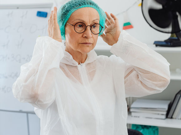 the medical worker is wearing Disposable Medical Isolation Gowns