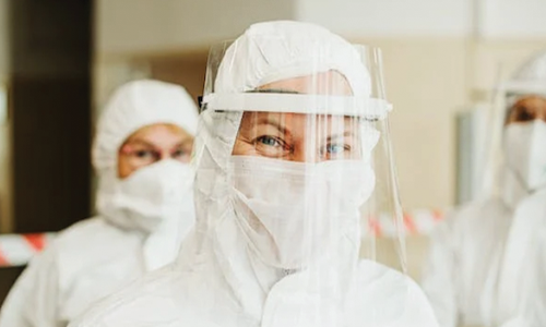 A Woman in White Hazmat Suit