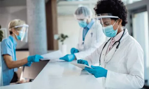 A doctor wearing a face shield