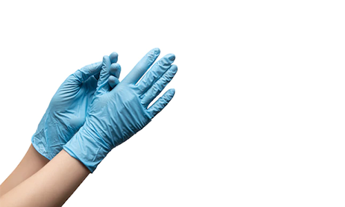 Female hands in disposable gloves