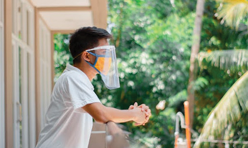 Man in White T shirt Wearing Face Shield