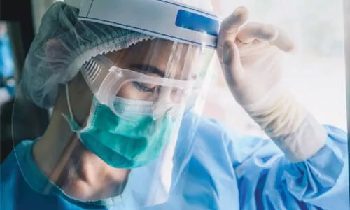 Woman wearing a face shield
