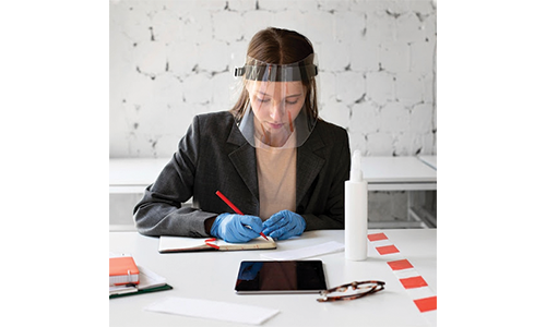 Woman working with face shield